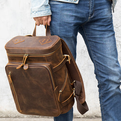 Velavio Vintage brown leather backpack carried by the top handle