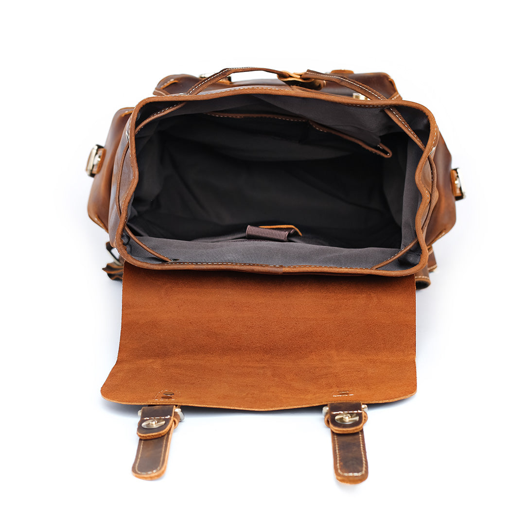 Brown leather backpack with open front compartment on a white background