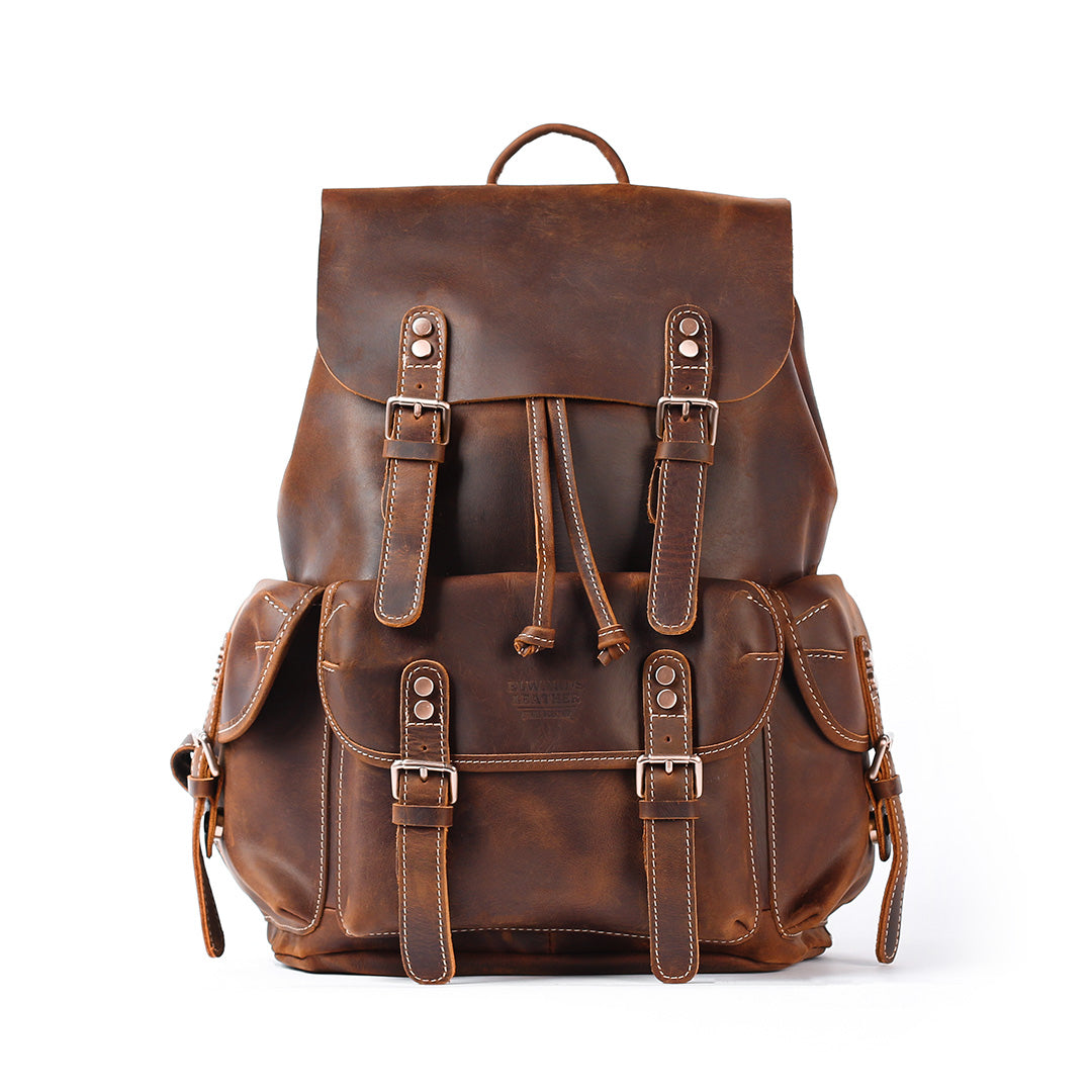 Brown leather backpack on a white background