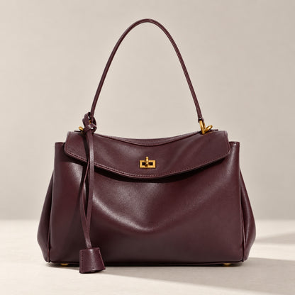 Kensington leather shoulder bag in burgundy with gold twist-lock