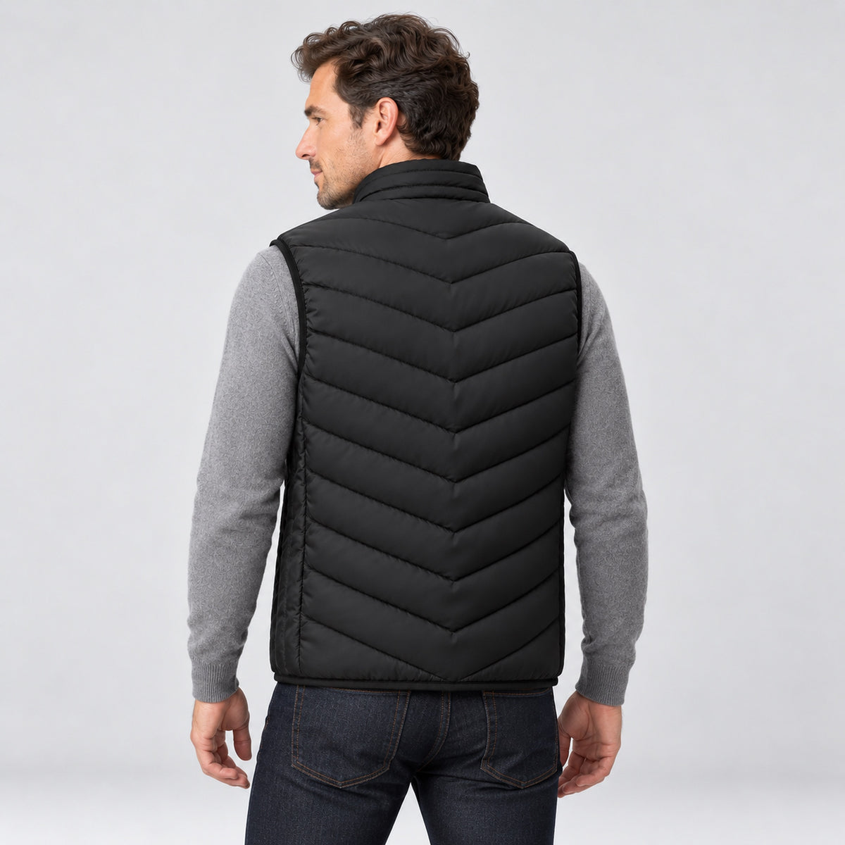 Man wearing the heated vest, back view